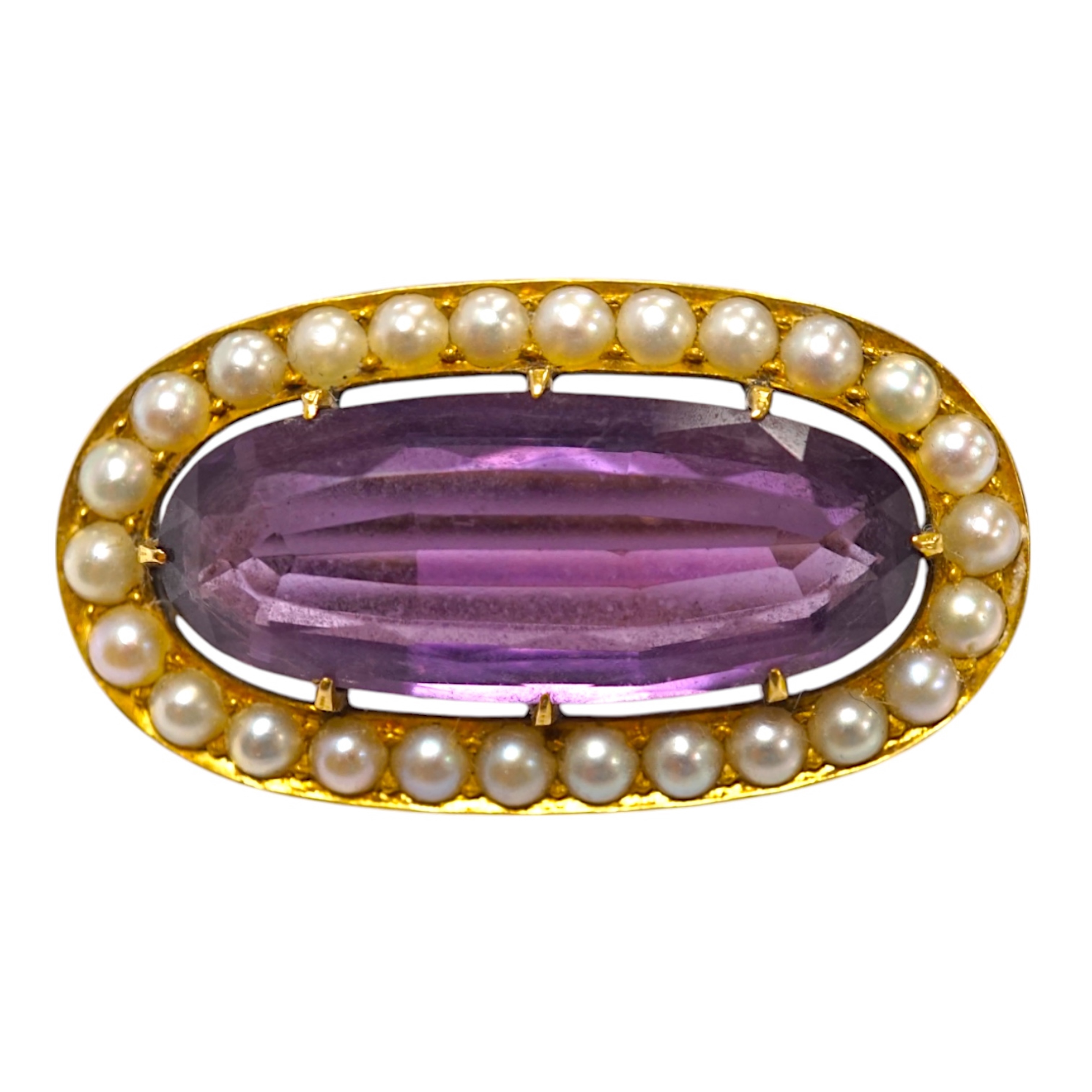 An early 20th century yellow metal mounted amethyst and split pearl cluster set oval brooch, 32mm, gross weight 8.8 grams. Condition - fair to good